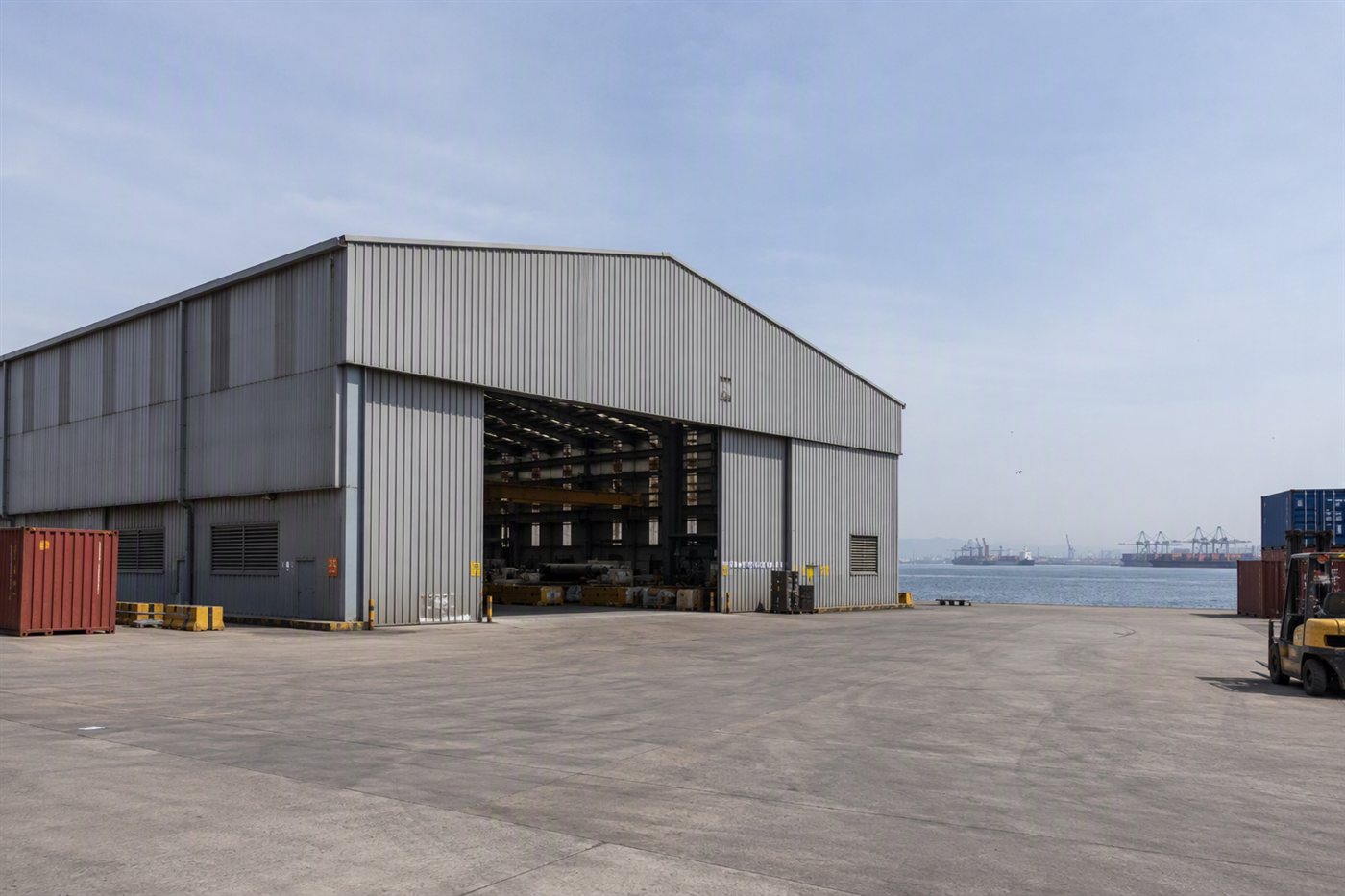 Completed steel warehouse building, photographed from outside.