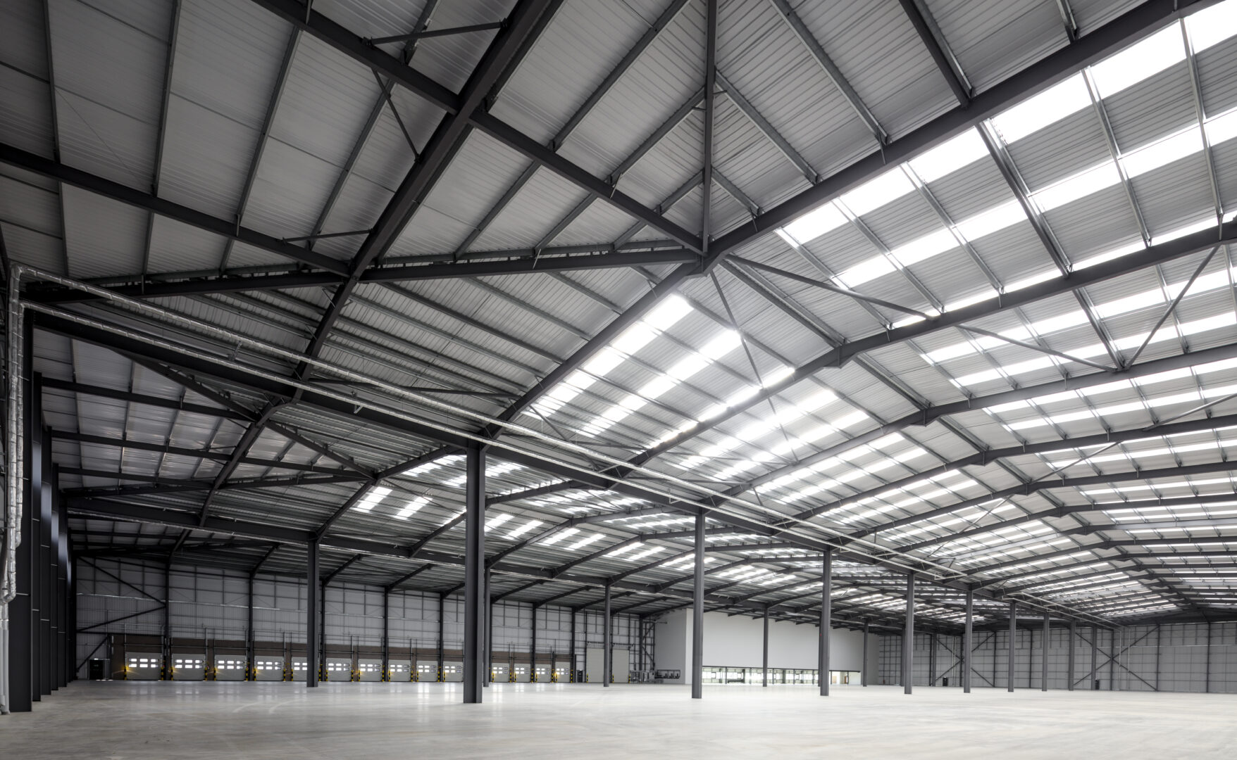 Interior of a completed steel building with a clear span and no internal columns.
